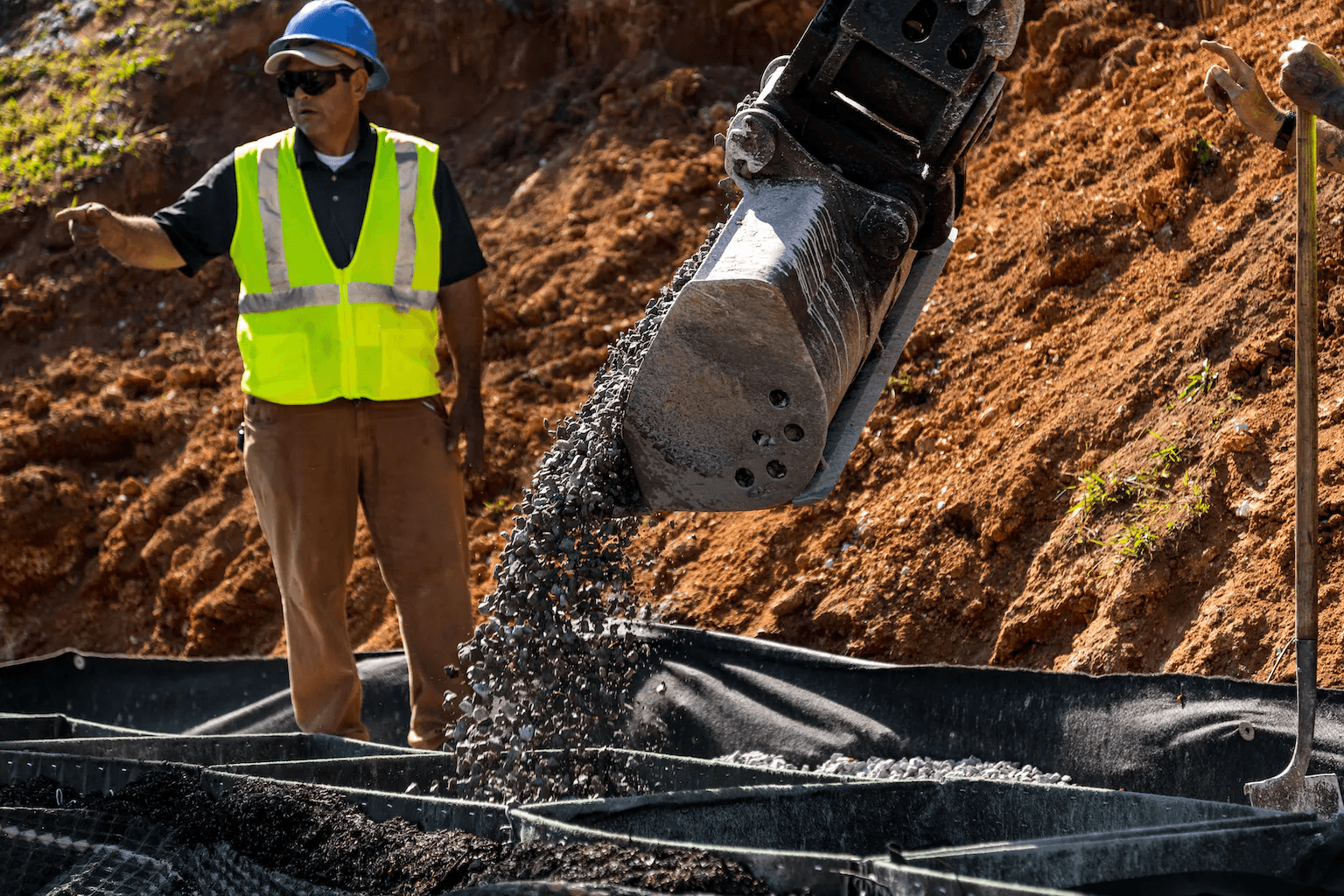 Engineering a gravity wall system involves using the weight of materials like rock-filled gabions or concrete blocks to counteract earth pressures, with design options including vegetated facades and innovative materials for enhanced stability.