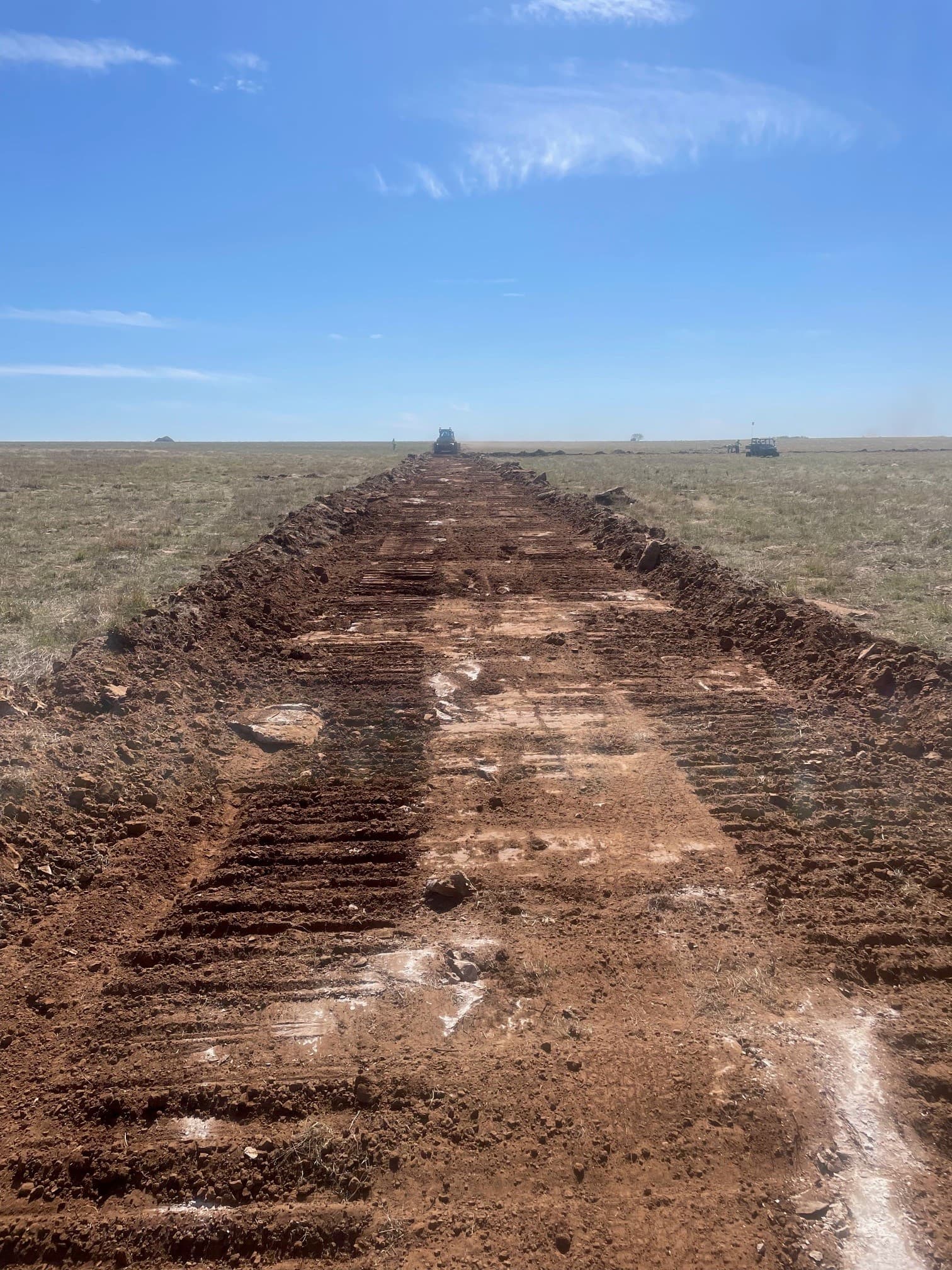 Field crew installing MIRAFI RS380i to improve bearing capacity.