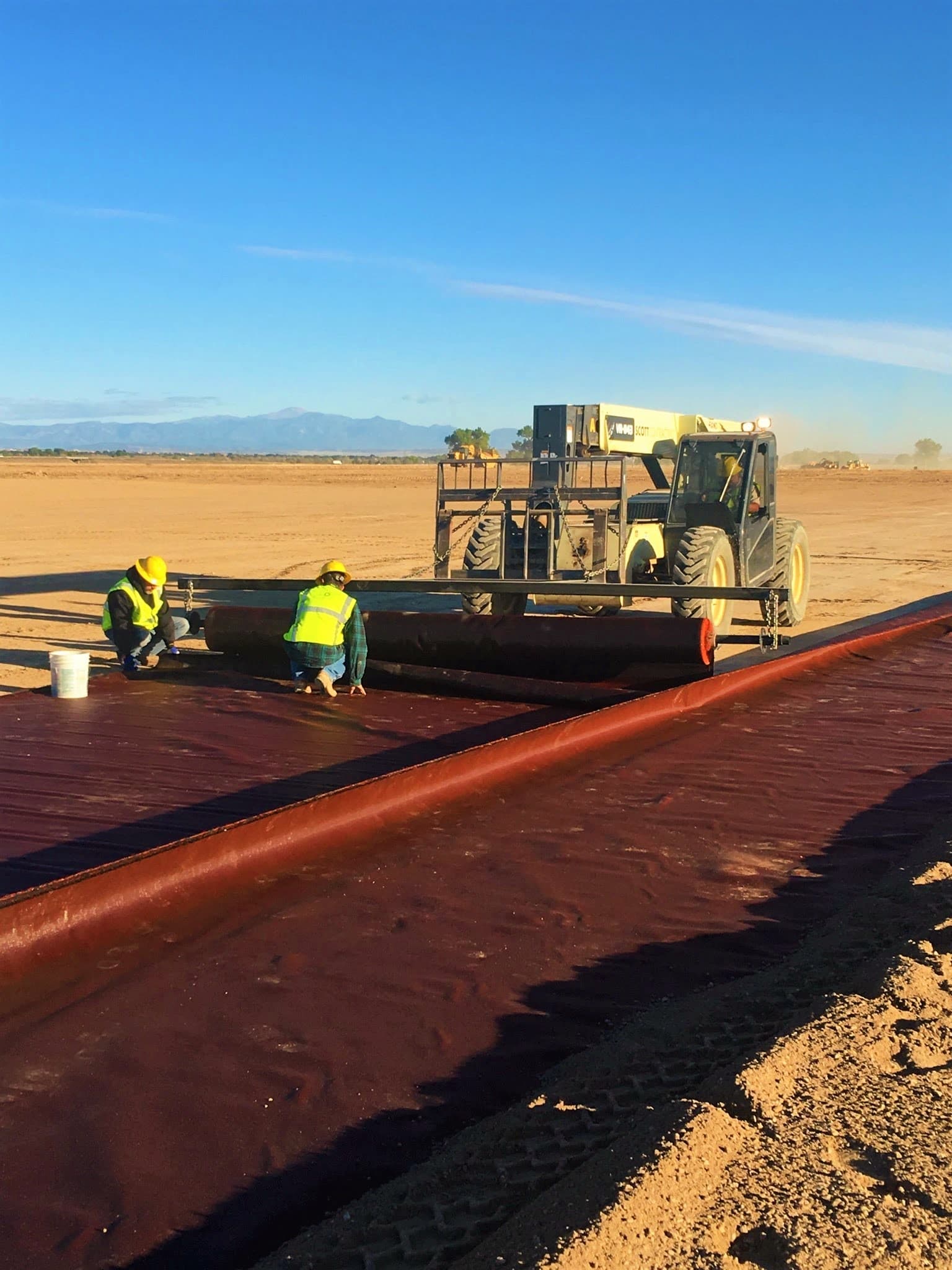 Installation of MIRAFI RSi geotextile to stabilize poor soil conditions and accelerate yard construction.