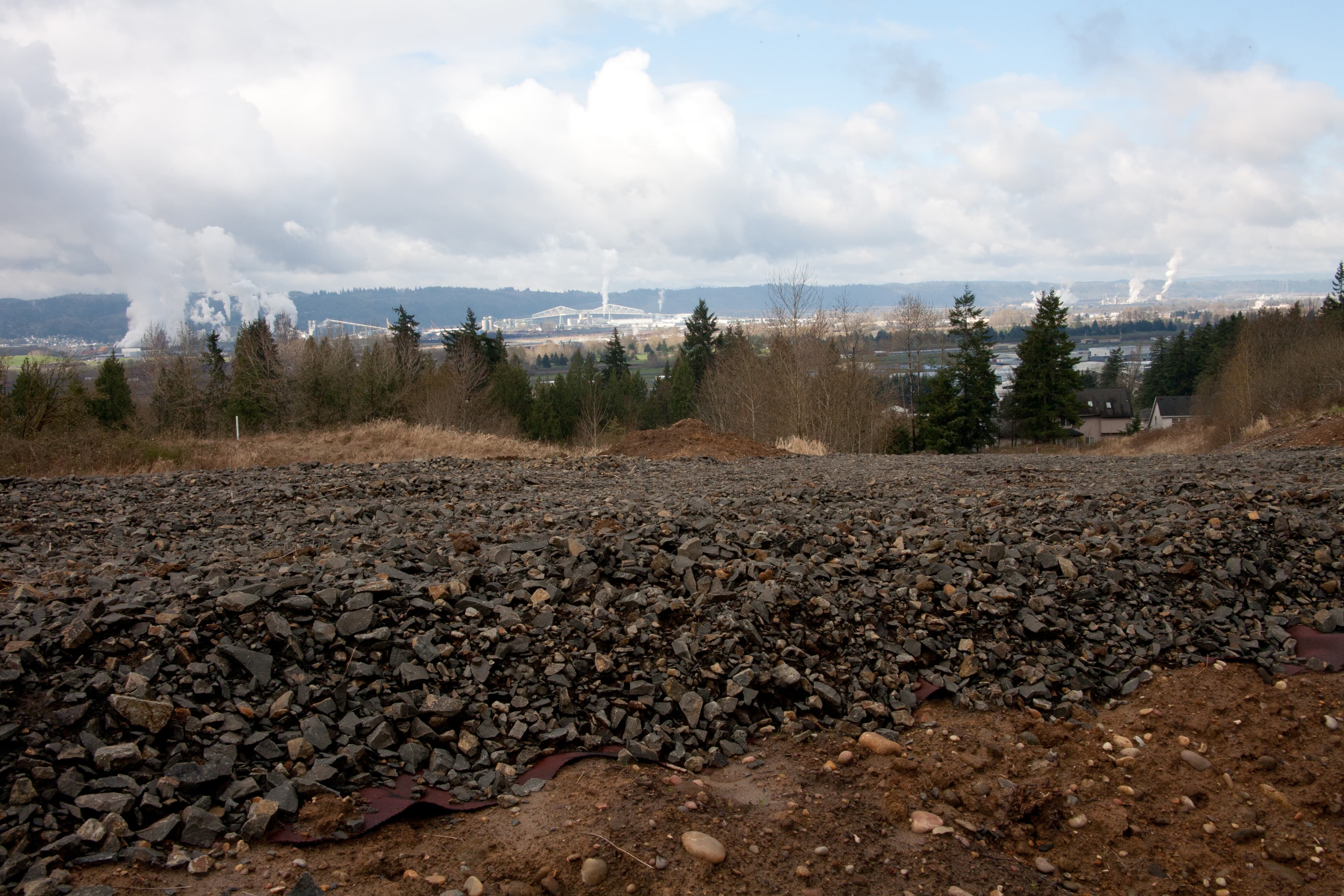Four layers of geogrid were combined with CSBC and HMA surfacing, reinforcing the roadway while mitigating soil saturation at the bottom of the slip zone
