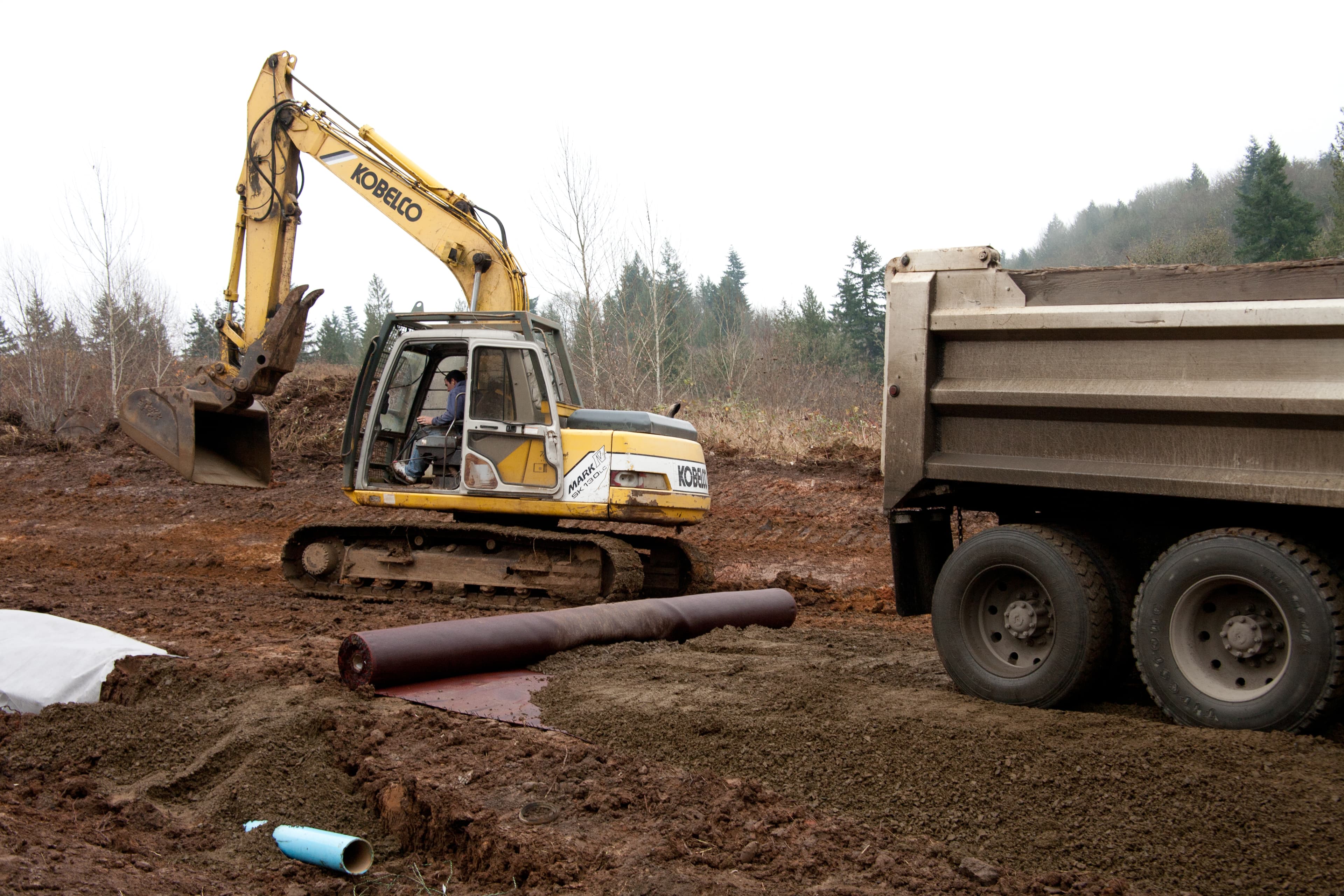 The MIRAFI H2Ri system was installed to prevent moisture accumulation beneath the slope repair, addressing the known slip plane and ensuring long-term stability