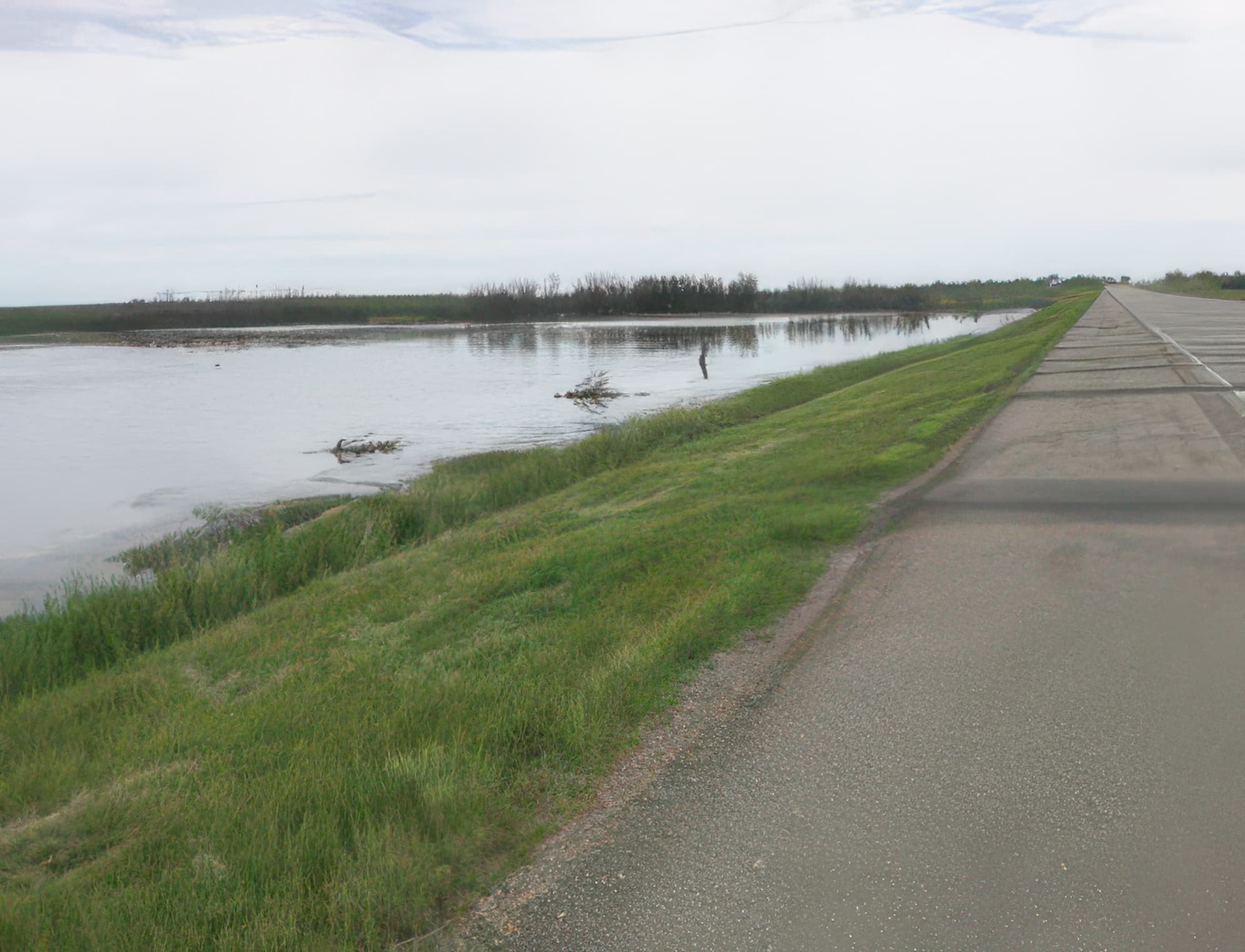 Newly constructed section of Highway 7 across slough, stabilized with reinforced embankment