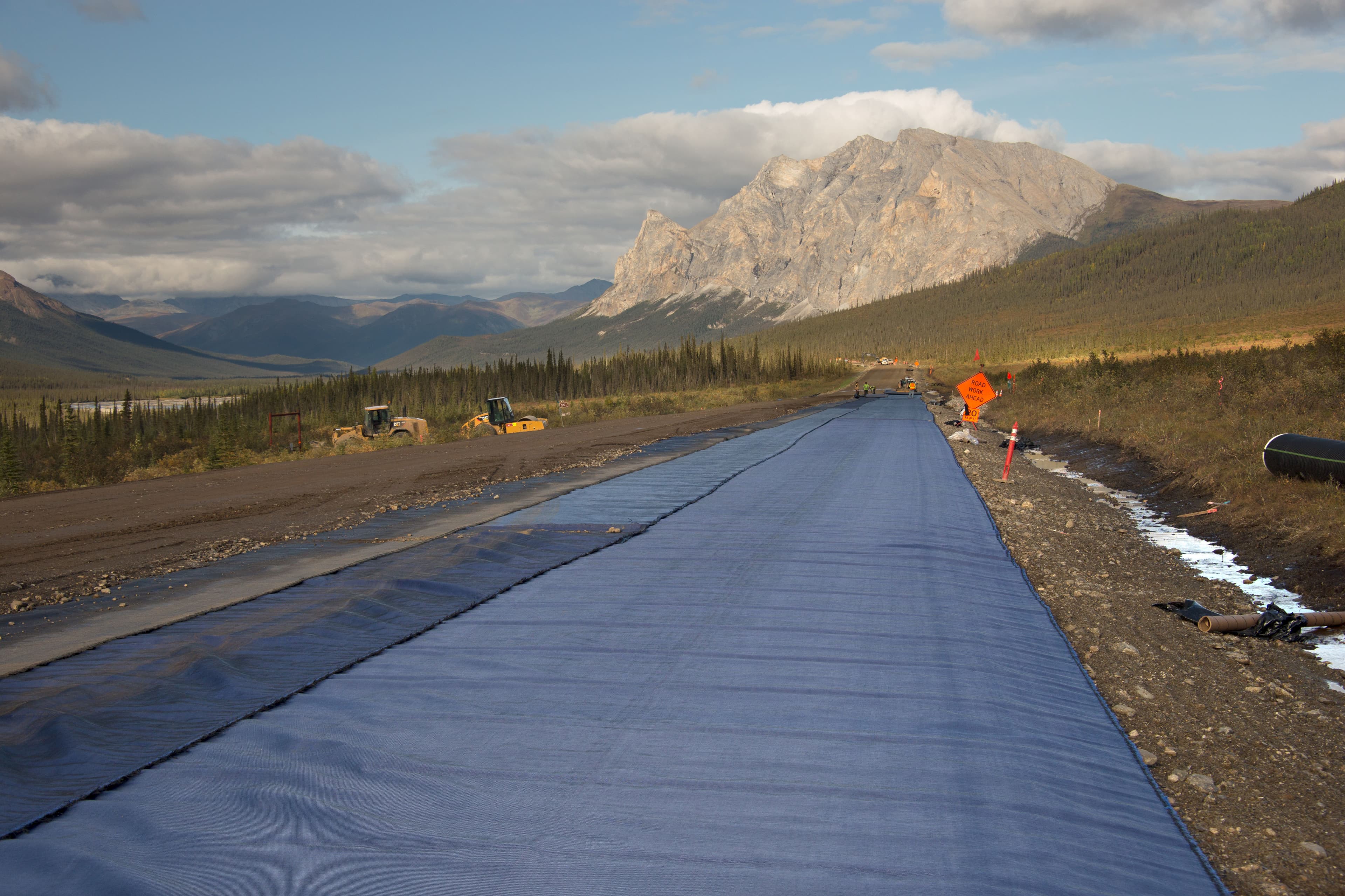 Alaska's Dalton Highway underwent a groundbreaking field study using the MIRAFI H2Ri system, significantly improving road stability and reducing maintenance needs in harsh northern climates.